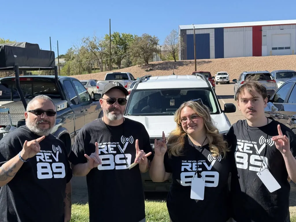 Bear and three Rev 89 teammates in station shirts