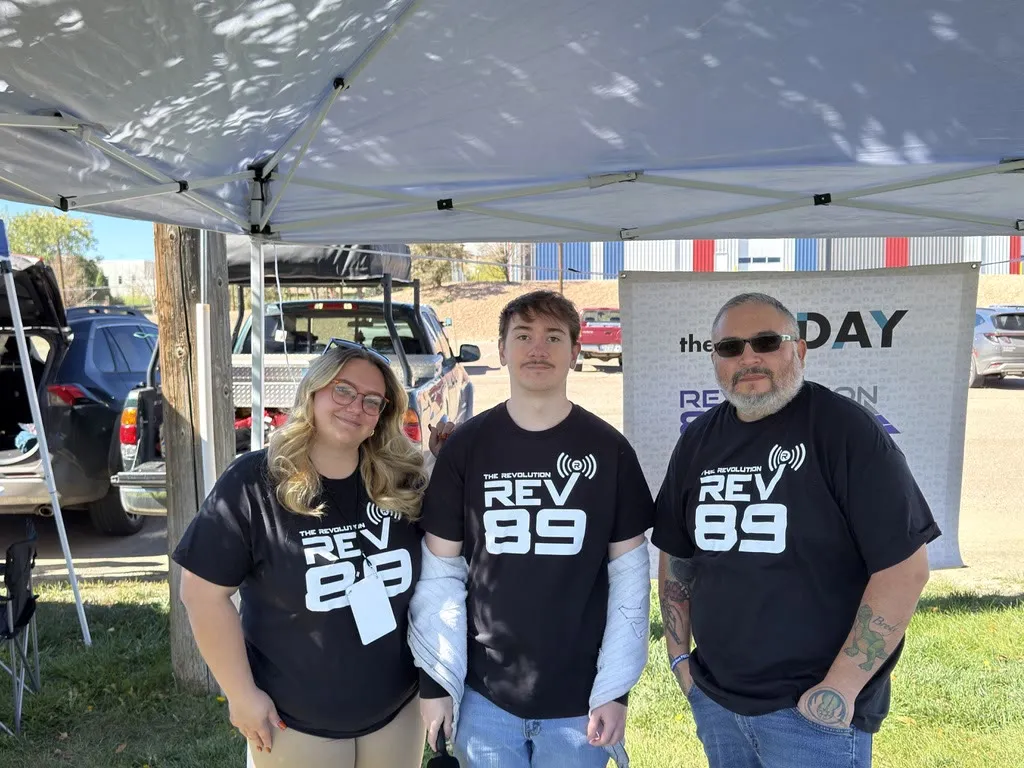Bear with two Rev 89 teammates under the station tent